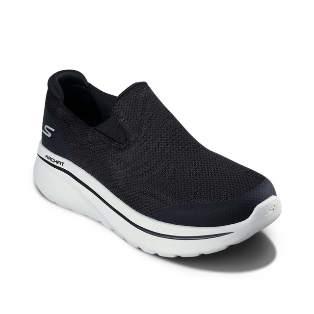 Black slip-on shoe with white sole on a white background