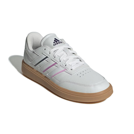 White Adidas sneaker with brown sole on a white background