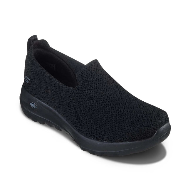 Black slip-on shoe on a white background