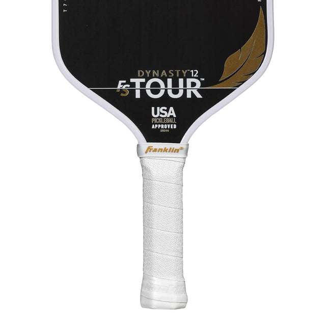 Pickleball paddle with 'Dynasty Tour' branding on a white background