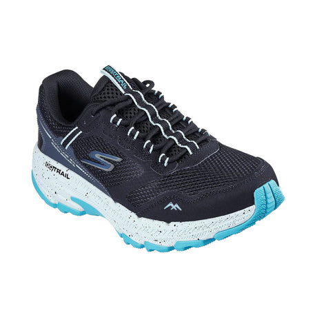 Navy running shoe with blue sole on a white background