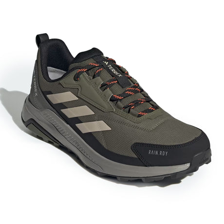 Green and black hiking shoe with brand logo on a white background