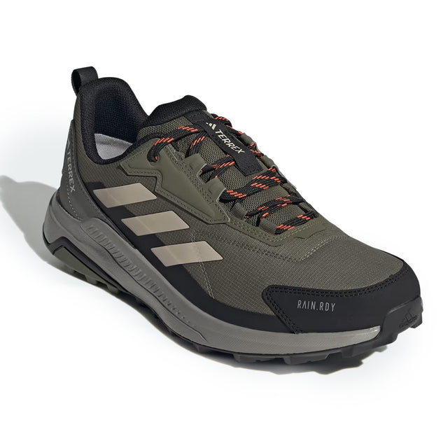 Green and black hiking shoe with brand logo on a white background