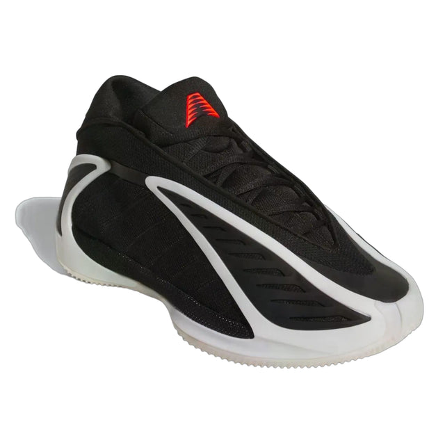 Black and white sneaker with red accents on a white background