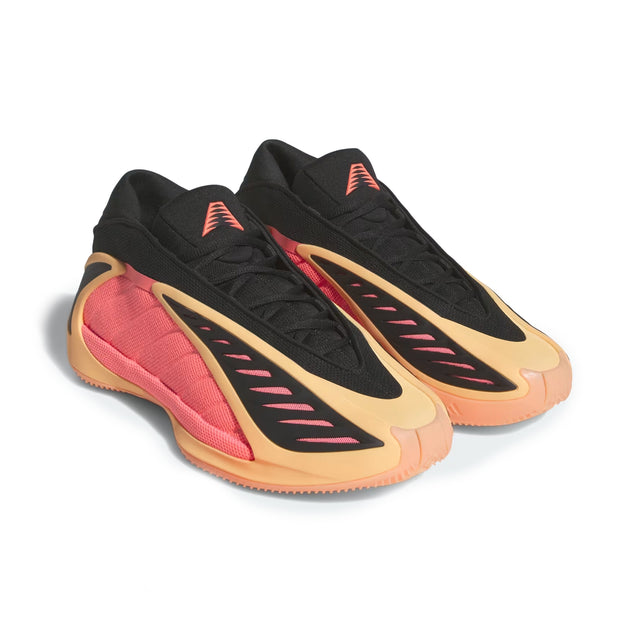 Black, red, and beige sneakers on a white background