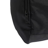 Close-up of a black backpack corner with zipper